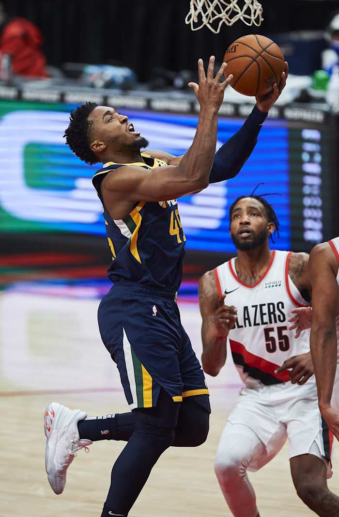 Donovan Mitchell (45) scores against the Portland Trail Blazers